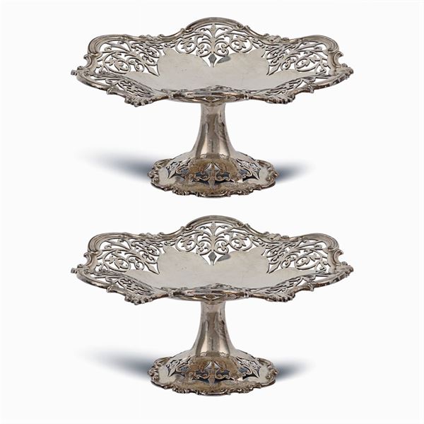 A pair of silver metal stands