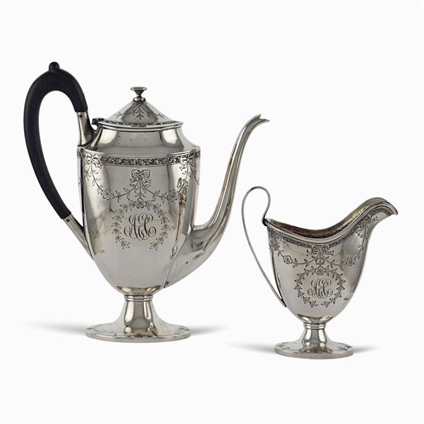 Silver teapot and milk jug