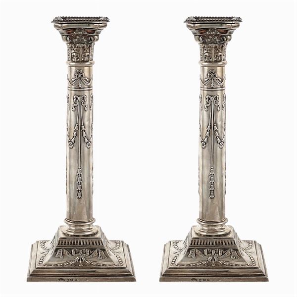 A pair of silver chandeliers