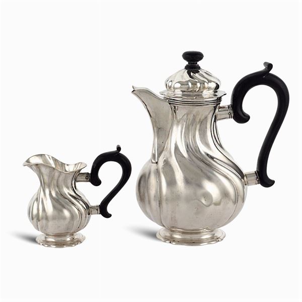 Silver teapot and milk jug