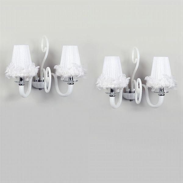 A pair of two lights glass wall lamps