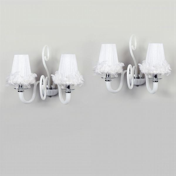 A pair of two lights glass wall lamps