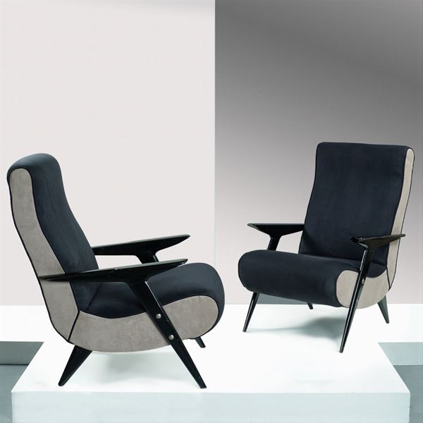 A pair of wood armchairs