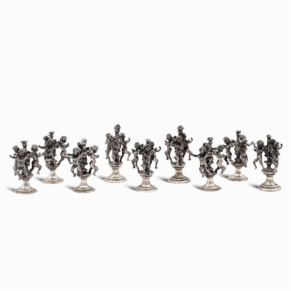 A set of silver seat markers(9)
