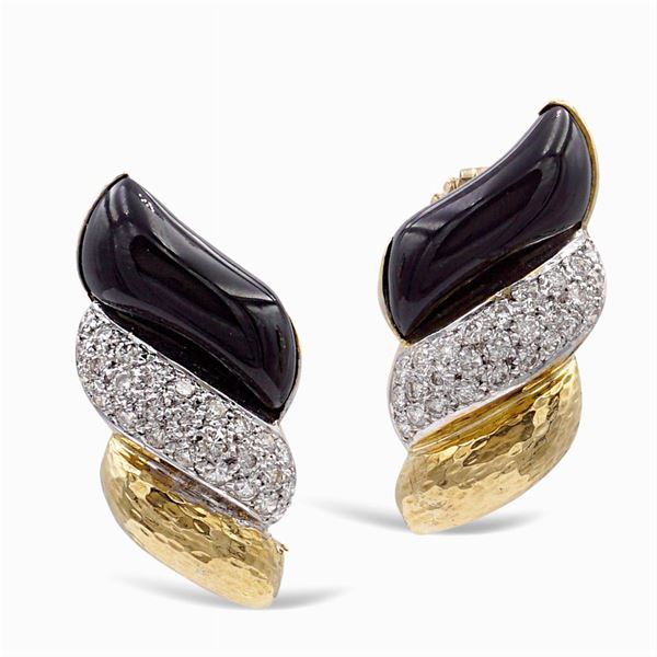 Orecchini in oro giallo 18kt liscio e martellato