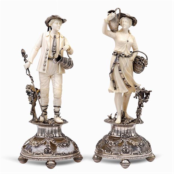 Coppia di sculture in argento, avorio e cristallo