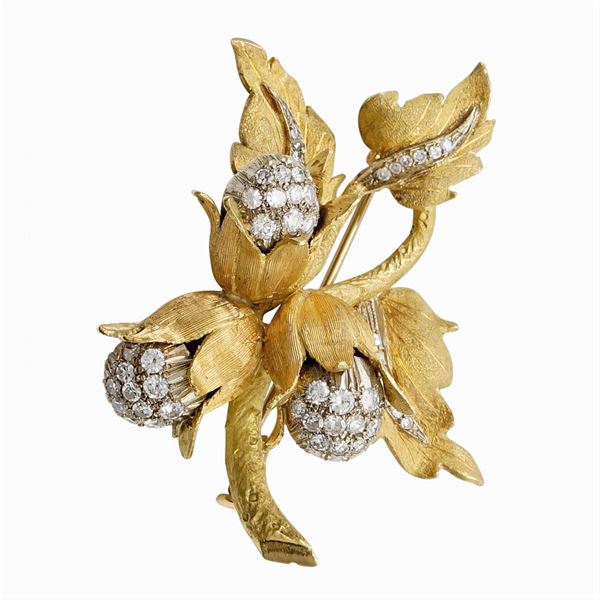 Spilla a motivo floreale in oro giallo satinato 18kt