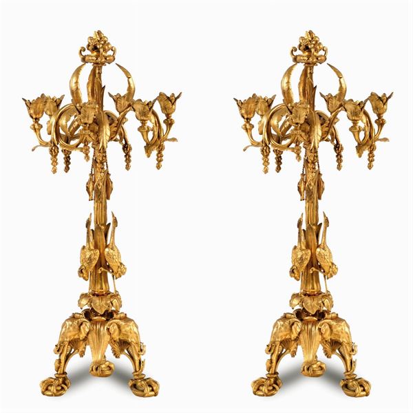 Pair of gilded and chiseled bronze candelabra