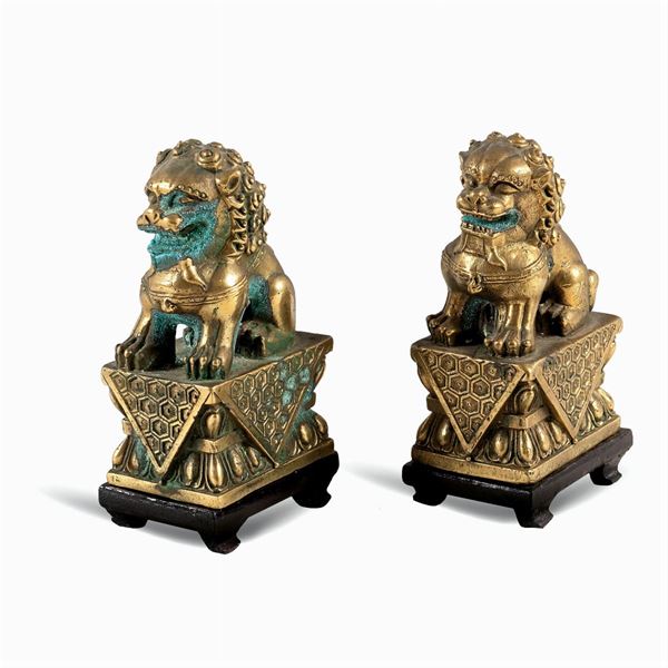 Coppia di sculture in bronzo dorato