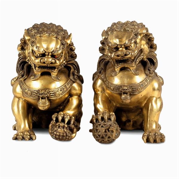 Pair of golden metal sculptures