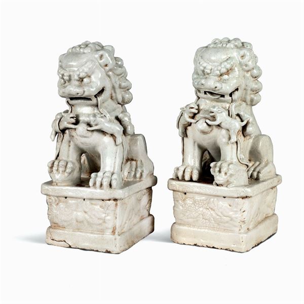 Pair of white glazed terracotta figures