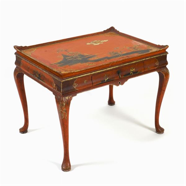 Red lacquered and giltwood table