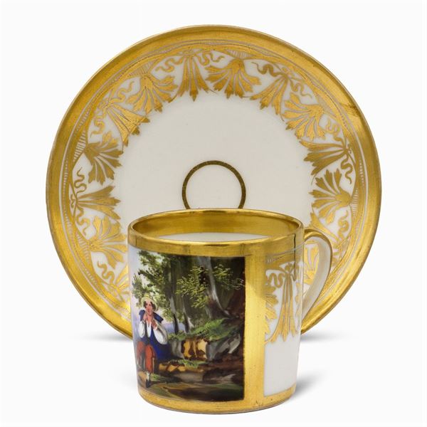 Polychrome and golden porcelain cup with saucer