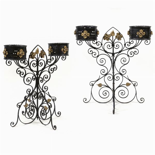 A pair of wrought iron jardinieres