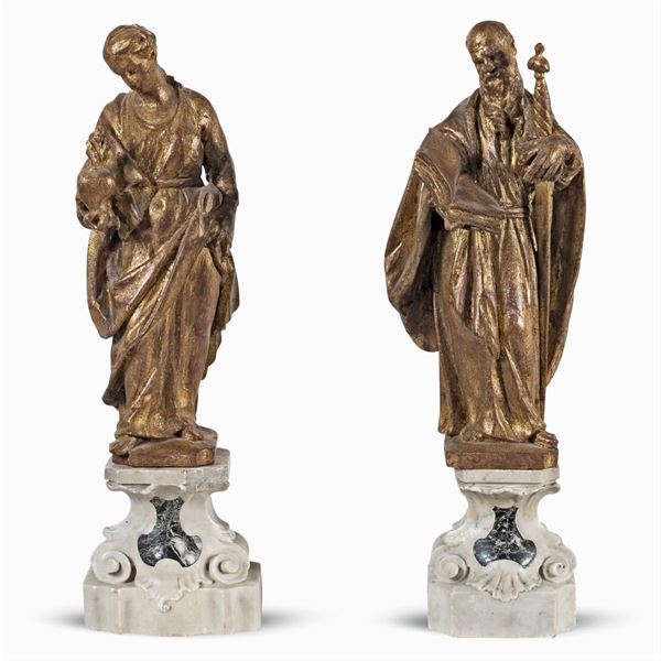 Coppia di sculture in legno dorato ed intagliato