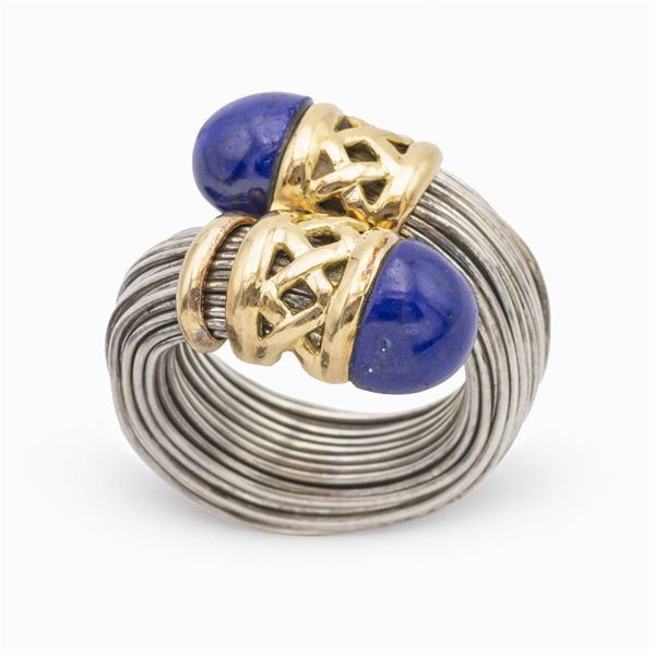 Anello contrarié in argento e oro giallo 18kt