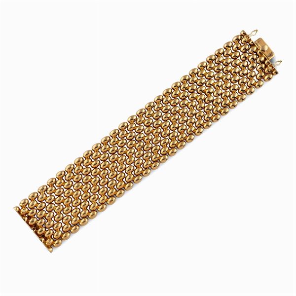 Bracciale a fascia alta in oro giallo 18kt  (anni 40/50)  - Asta GIOIELLI E OROLOGI - Colasanti Casa d'Aste
