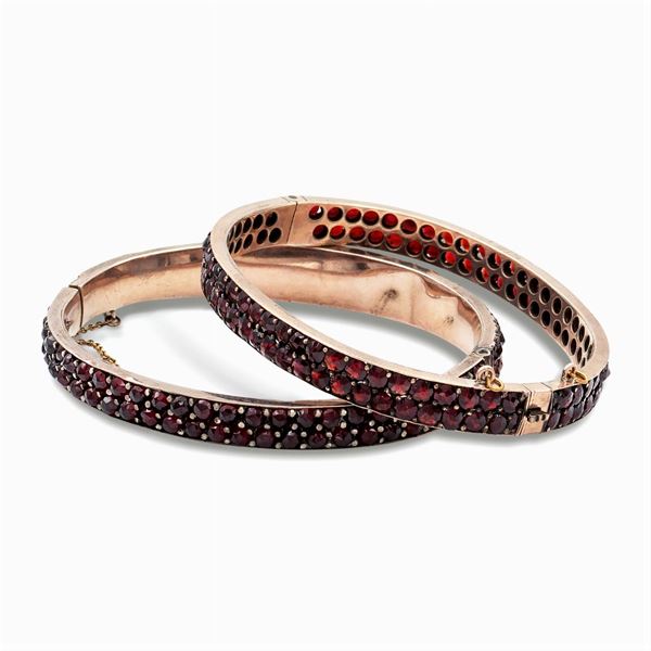 Two bangle bracelets with garnets