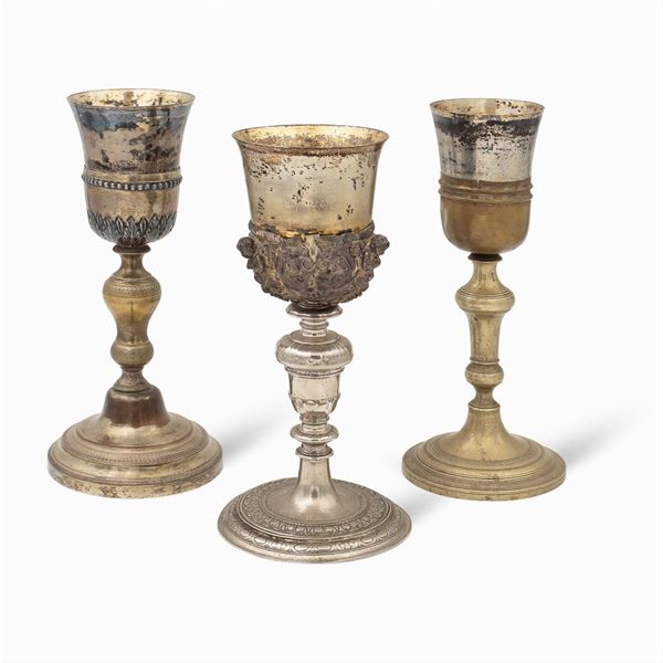 Group of silver and metal eucharistic chalices (3)