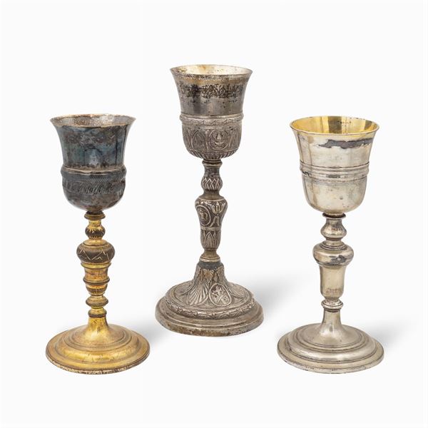 Group of silver and metal eucharistic chalices (3)