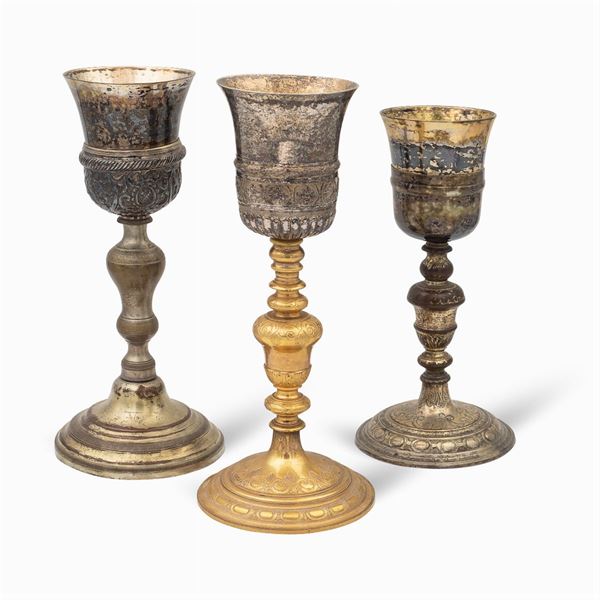 Group of silver and metal eucharistic chalices (3)