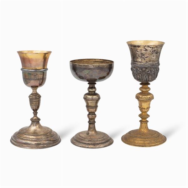 Group of silver and metal eucharistic chalices (3)