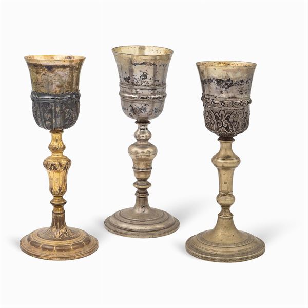 Group of silver and metal eucharistic chalices (3)