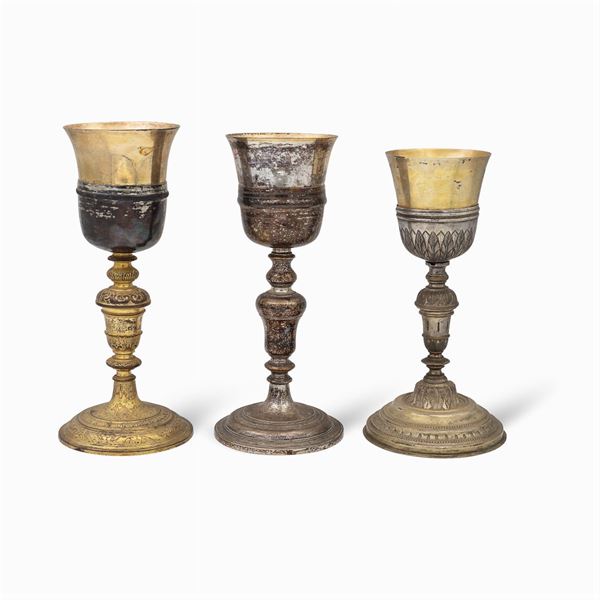 Group of silver and metal eucharistic chalices (3)