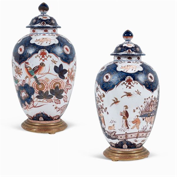 Pair of polychrome porcelain potiches