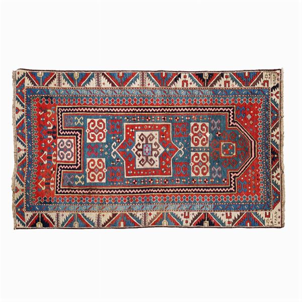An antique Caucasian carpet