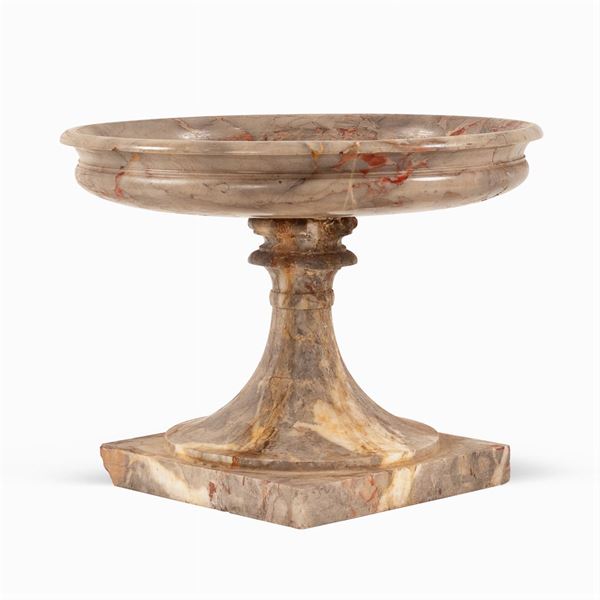 Marble stand resting on sqaure base