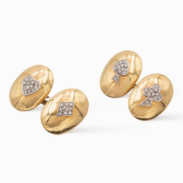 Gemelli ovali in oro a due colori 18kt con semi delle carte francesi