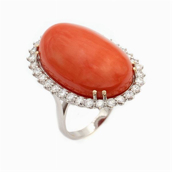 18kt white gold ring with a big red coral