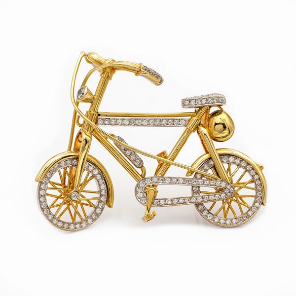Spilla bicicletta in oro giallo 18kt e diamanti