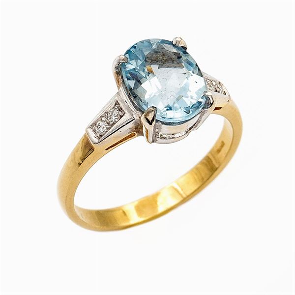 Anello in oro a due colori 18kt con acquamarina