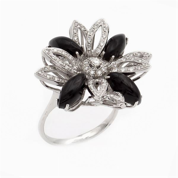 18kt white gold, black onyx and diamond flower ring