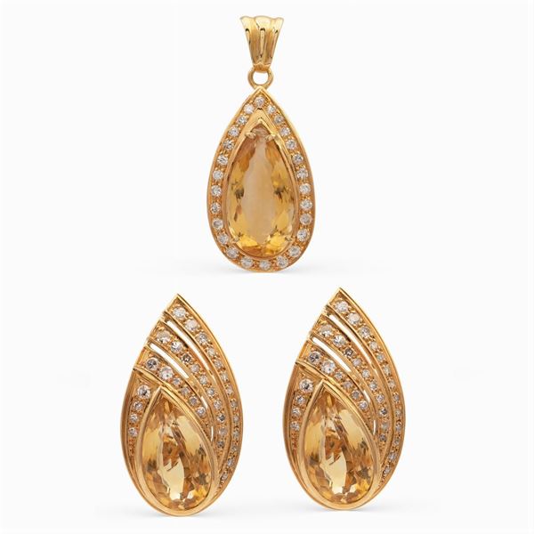 Orecchini a lobo e pendente en suite in oro giallo 18kt