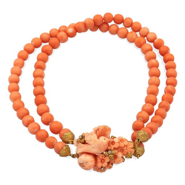 Two strands of pink coral necklace with central pendant