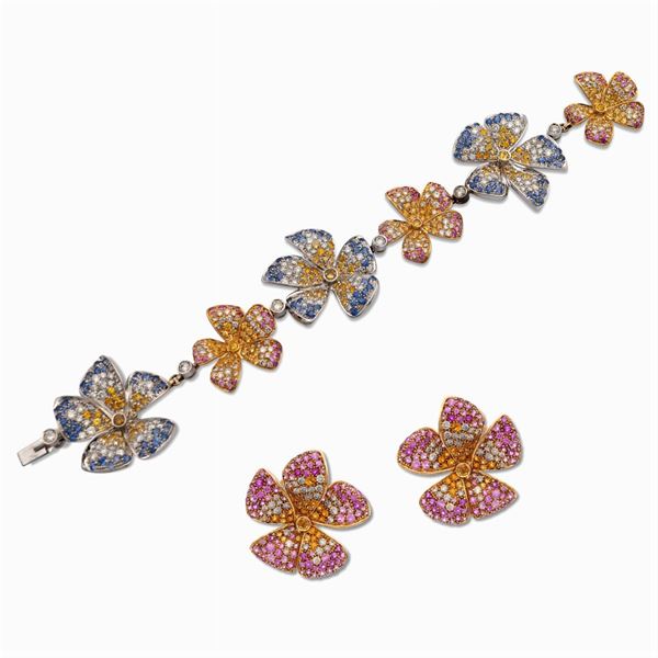 Parure a motivo floreale in oro bianco e giallo 18kt con zaffiri e diamanti
