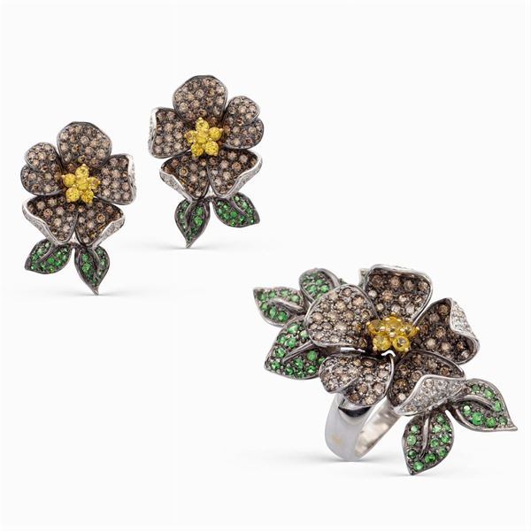 Parure a motivo floreale in oro nero 18kt, diamanti e zaffiri gialli