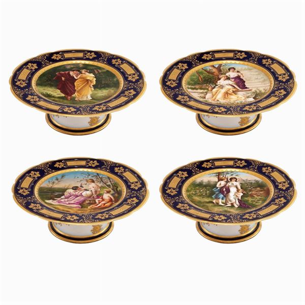 Four polychrome porcelain stands