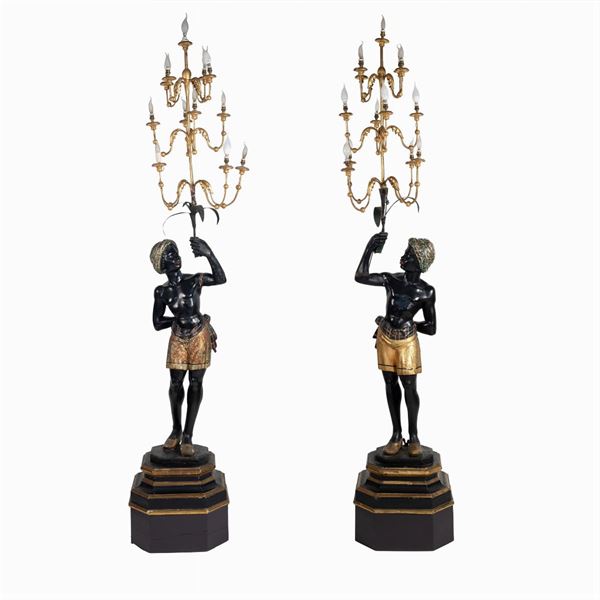 Pair of lacquered and gilt wood sculptures