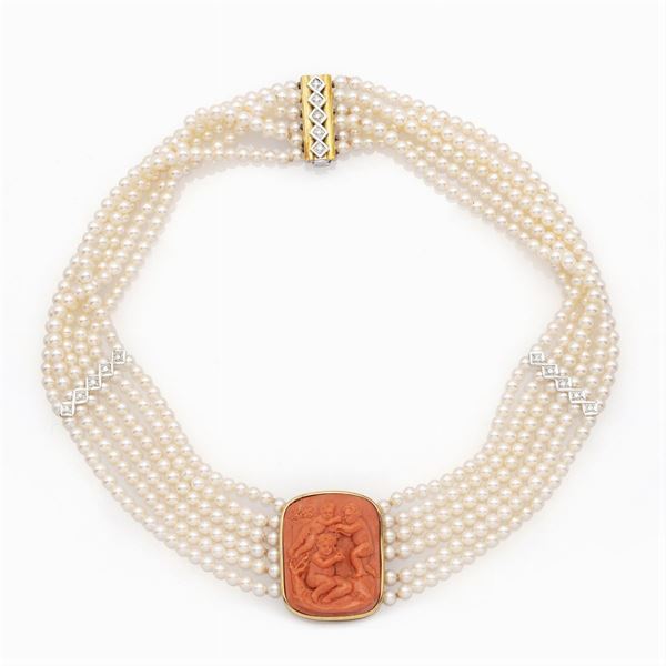 Six-strand pearl necklace centered by a carved coral cameo