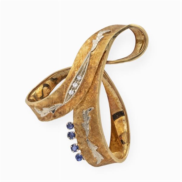 Spilla in oro giallo satinato e bianco 18kt