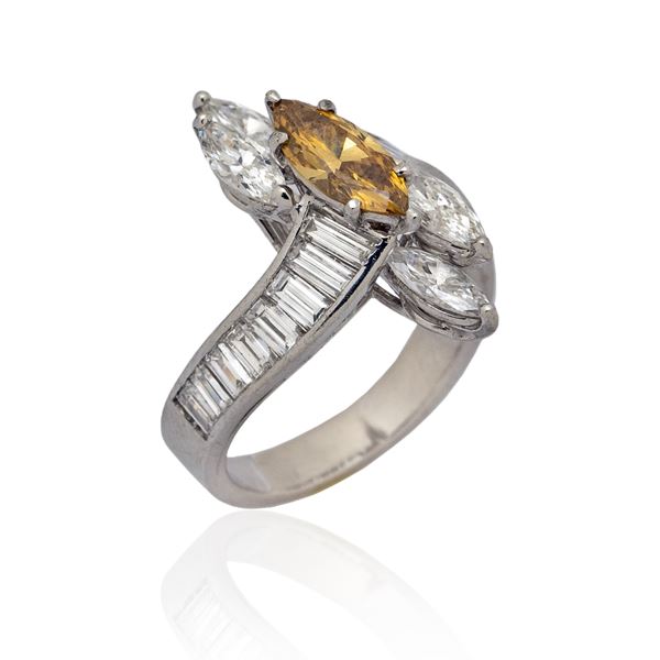 Platinum ring with a fancy yellow brown diamond ct 0.98 circa