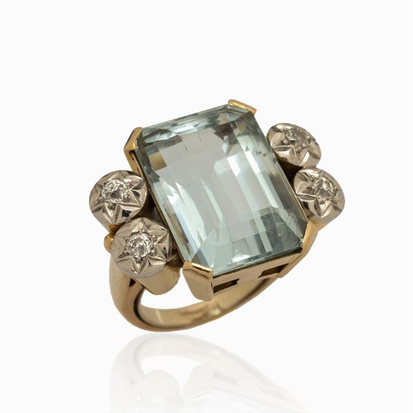 Anello a ponte in oro giallo e bianco 18kt con acquamarina