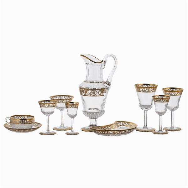 Saint-Luois, set of glasses in transparent and golden crystal (51)  (France, 20th century)  - Auction FINE SILVER AND ART OF THE TABLE - Colasanti Casa d'Aste