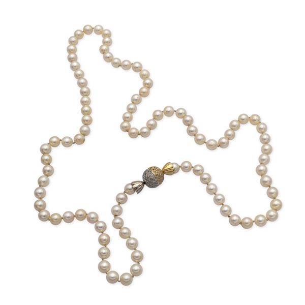 Long  strand of cultured pearls necklace