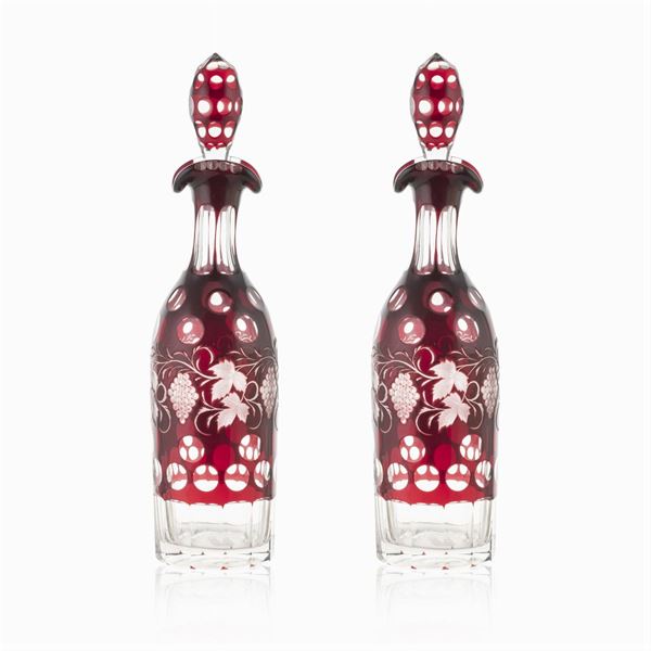 Pair of transparent and colored glass bottles