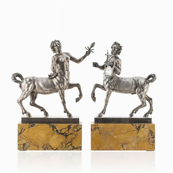 Coppia di sculture in argento e marmo